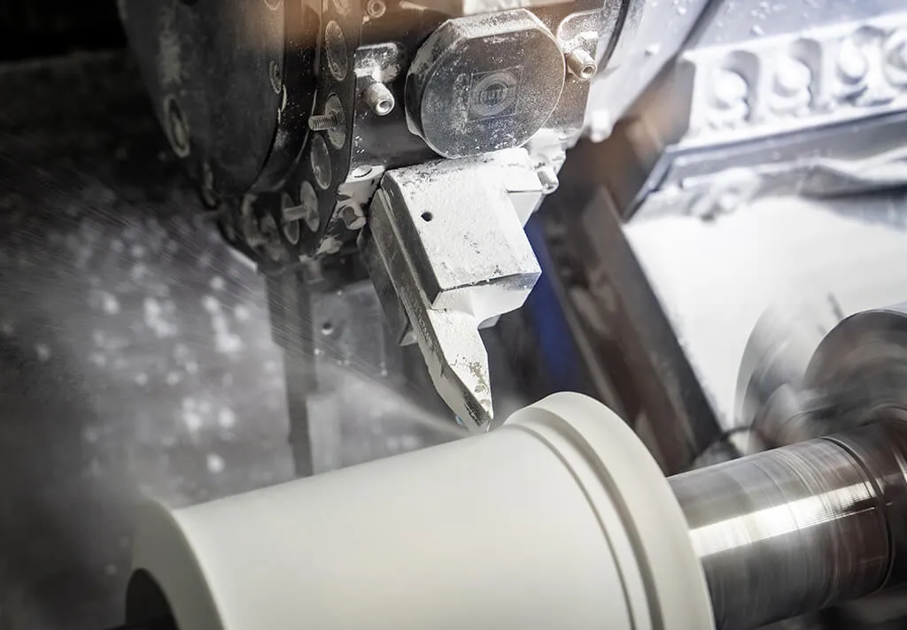 Technicians adjust ceramic components through machining before sintering to achieve the final geometry