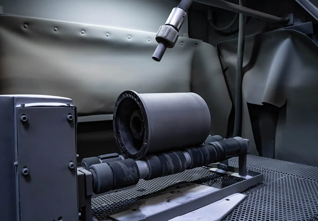 Custom ceramic coatings for metal carriers in textile machinery